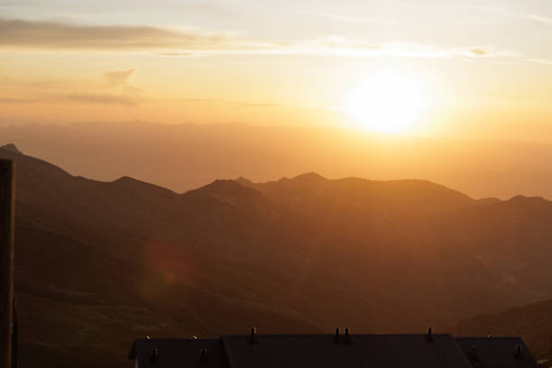 Landscape of distant Sierra Nevada mountains in Granada at sunset