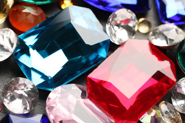 istock Different beautiful gemstones for jewelry on grey background, closeup 1758412988