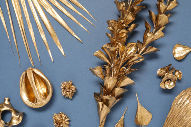 istock Flat lay composition with golden dried flowers on blue background 1758413545