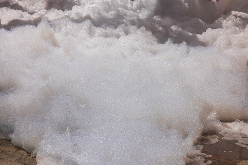 Close-up view of large pile of foam during outdoor foam party.