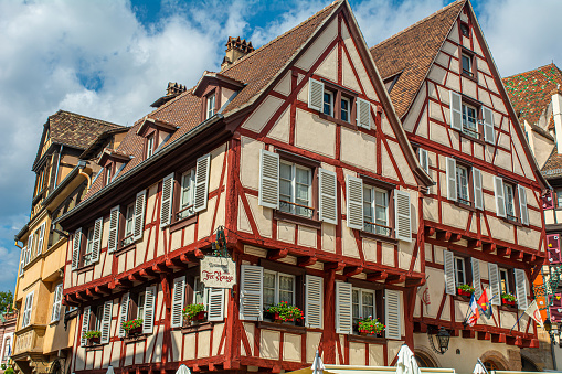 17. 07. 2023 Colmar, Alsace, France, red architectural details, and traditional half-timbered houses are tourist attractions.