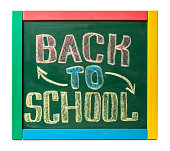 BACK TO SCHOOL hand drawn by chalk on a blackboard