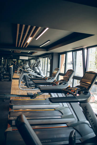 istock Row of treadmills in a gym 1758433441