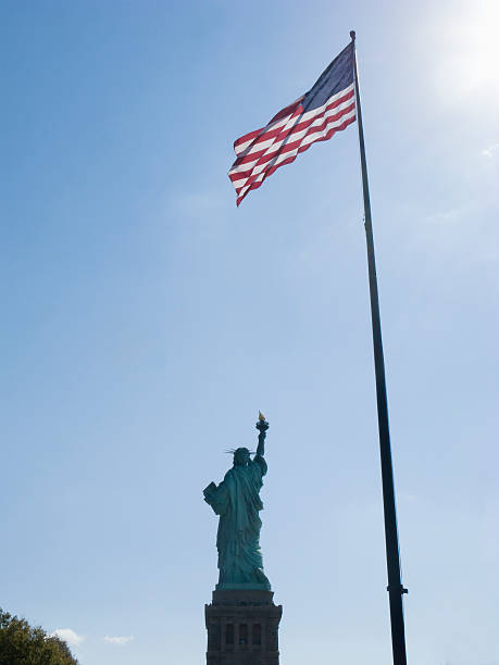 istock Statue of Liberty Under US Flag 175844049
