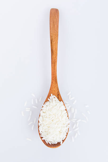istock Rice in a wooden spoon. 175844121