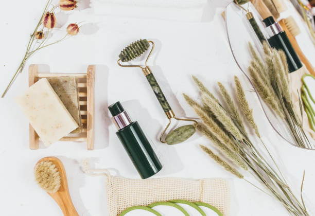 istock Facial roller from crystal rose quartz and massage tool jade on white background with dry flowers. Tools for anti-age massage, spa, wellness, natural face lifting at home. Mock up 1758448253