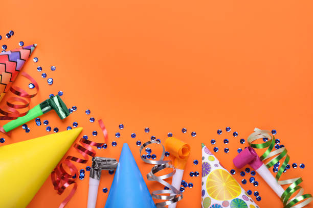 istock Flat lay composition with accessories for birthday party on orange background. Space for text 1758448872
