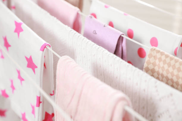 istock Different apparel drying on clothes airer, closeup 1758449983