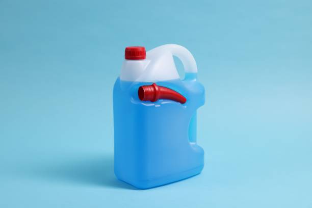 istock Plastic canister with color liquid on light blue background 1758449994