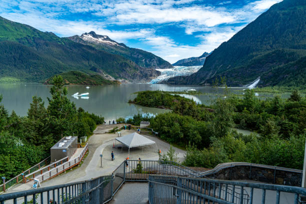 Skagway, Alaska - Aug. 6, 2023: Touirts are enjoying the view of Mendenhall Lake, Skagway, Alaska, USA.