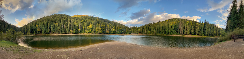 Picturesque lake in the autumn forest. Mountain Lake Synevyr in Carpathian, Ukraine. Panorama