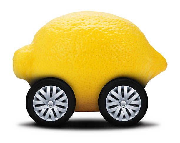 Lemon Car This is a conceptual photo related to a purchasing a car with a lot of problems otherwise know as a lemon. awful taste stock pictures, royalty-free photos & images