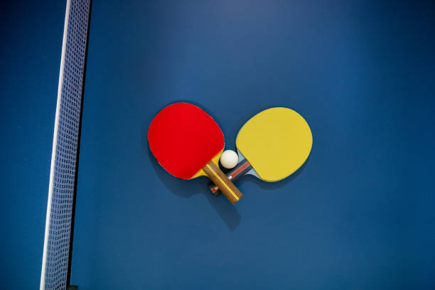 istock Two table tennis rackets and a ball placed on a tennis table. 1758490291