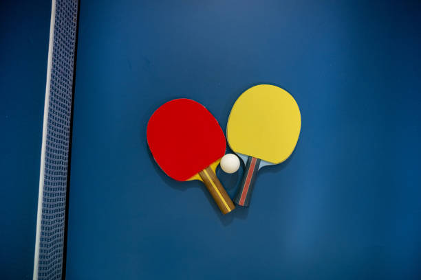 istock Two table tennis rackets and a ball placed on a tennis table. 1758490295