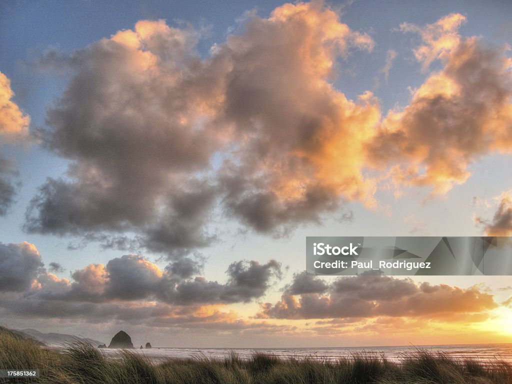 passing clouds over haystack solace moment in Cannon Beach American Culture Stock Photo