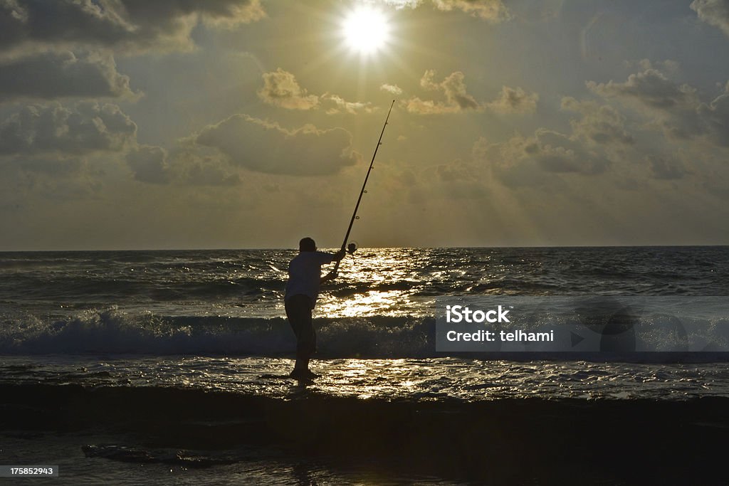 Angler na plaży - Zbiór zdjęć royalty-free (Biznes)