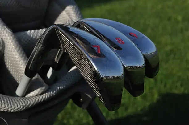 Close up of 7, 8, & 9 Irons (Clubs) in a Golf Bag