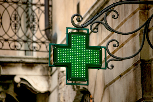 A pharmacy sign in the city of Verona, Italy