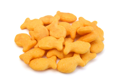 A scaterring of yellow goldfish crackers.