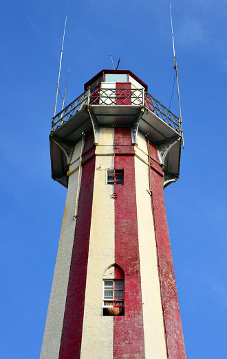 Georgetown, Guyana: Georgetown Lighthouse, built by the British on 1830, over an older Dutch structure -  octagonal tower made iconic by its red and white stripes that, unusually, are vertical - guides ships into the Demerara River from the Atlantic Ocean - Water Street.