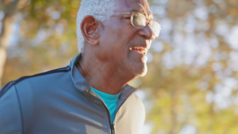 Senior black man jogging in the park