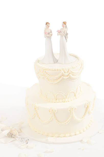 Lesbian Wedding Cake with Figurine Topper on White Background