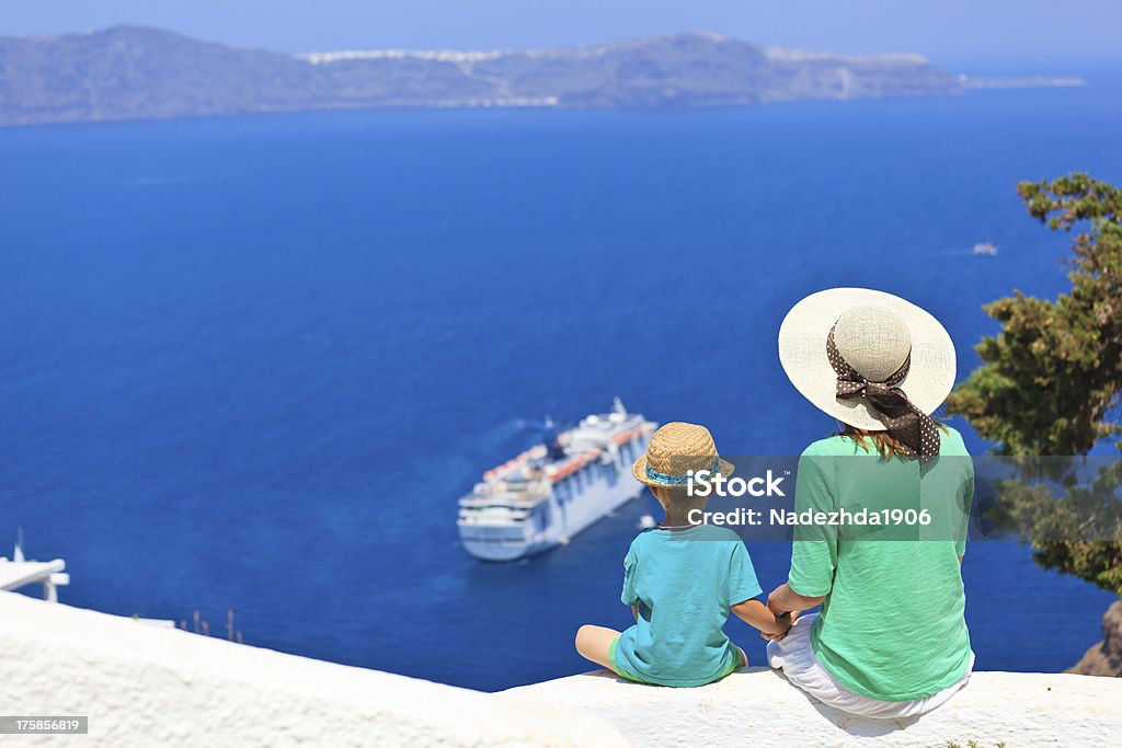 family looking at Santorini, Greece family looking at Santorini, Greece. Travel concept Ship Stock Photo