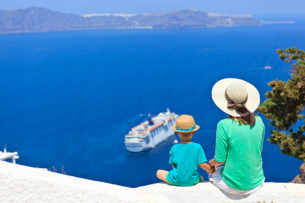 family looking at Santorini, Greece family looking at Santorini, Greece. Travel concept passenger craft stock pictures, royalty-free photos & images