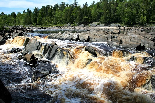A stunning flowing river and waterfall in Jay Cooke state park
