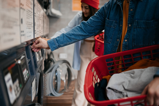 Young heterosexual couple in a laundry room