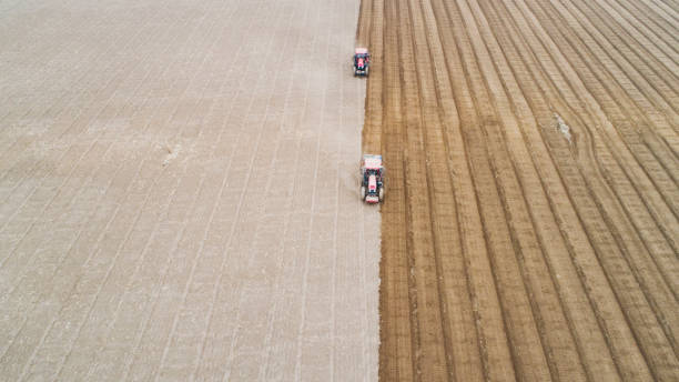 istock seeder sows in the field, North China 1758673782