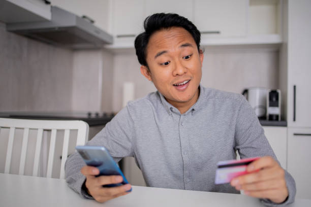 istock Happy young customer enjoys shopping online 1758736981