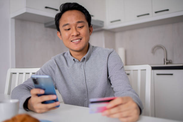 istock Happy young customer enjoys shopping online 1758737494