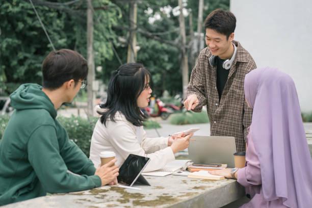istock Multi ethnic group of university students working together outdoors on campus. 1758755411