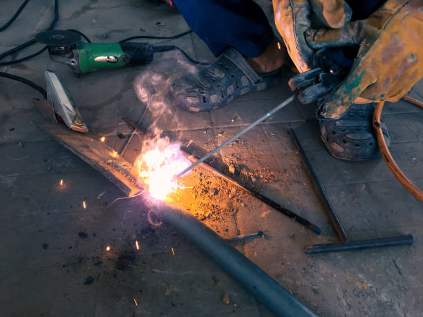istock Man welding steel, blurred on black background 1758774269