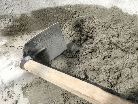 Mixing tool with of stone, cement, sand together to make a strong concrete floor, Construction concept