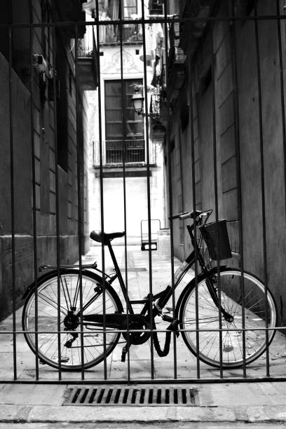 A bike an an alley way in Barcelona, Spain, in black and white