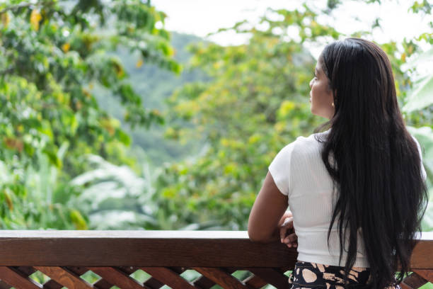istock Latin woman standing on balcony 1758813065