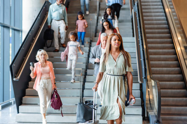 istock Multicultural Passengers With Baggage Going Down Staircase in Airport 1758814765