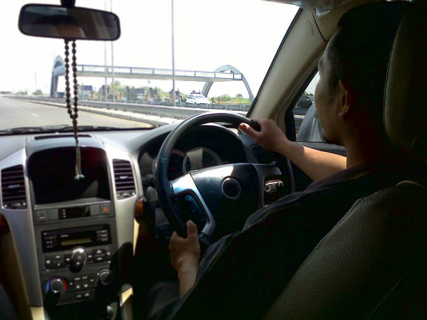 istock A man is driving on the highway. 1758819601