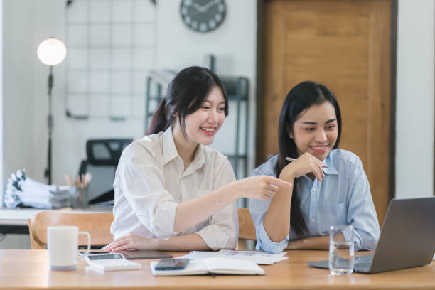 istock Two millennial asian female entrepreneurs working together on digital laptop computer. 1758844546