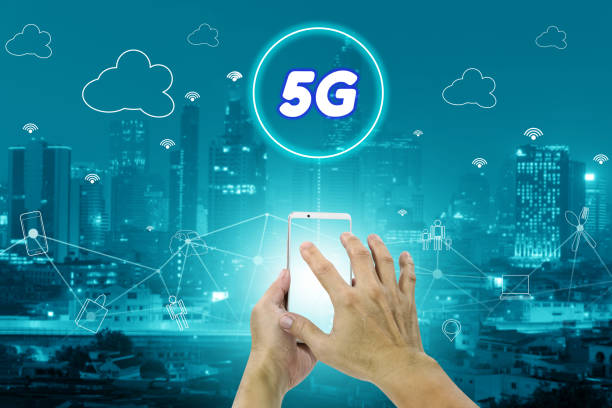 istock 5G network interface and icon concept,hand holding mobile smart phone with cityscape 1758858483