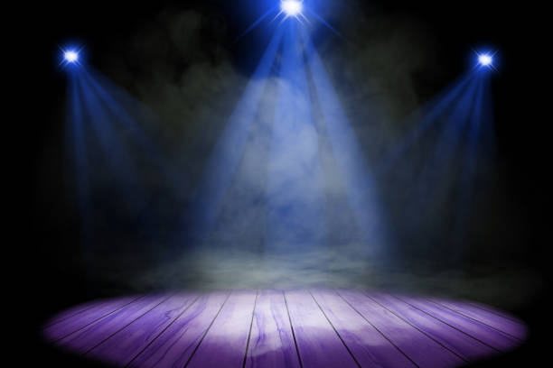 istock Blue purple lighting and smoke on stage with floor wood 1758861302
