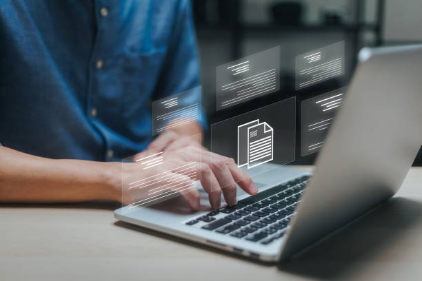 istock Businessman working on laptop with virtual screen. Process automation to efficiently manage files. Online documentation database and document management system concept. 1758862638