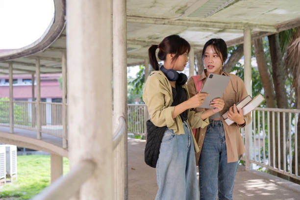 istock Two college student female friends smile ready for class at the university campus 1758920399
