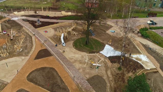 Aerial view overlooking a bulldozer moving soil on a park construction site