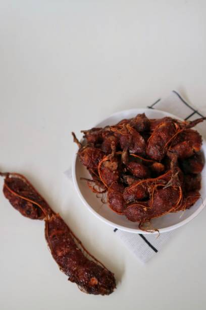 istock Ripe tamarind or asam jawa isolated on white background. 1758931820