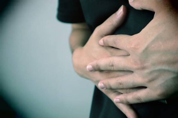 istock Person suffering from stomach pain 1758977283