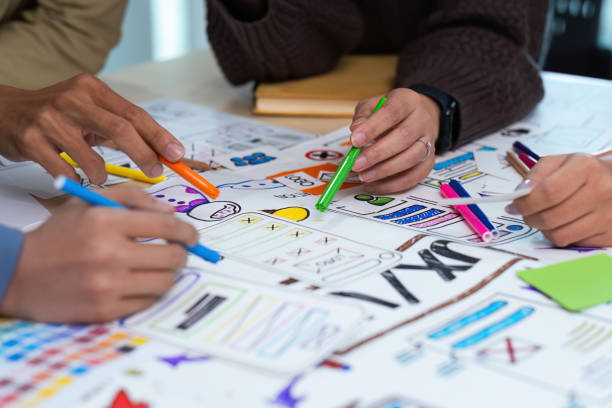 istock Close up ux developer and ui designer use augmented reality brainstorming about mobile app interface wireframe design on desk at modern office. creative digital development agency 1758980405