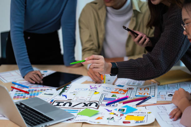 istock Close up ux developer and ui designer use augmented reality brainstorming about mobile app interface wireframe design on desk at modern office. creative digital development agency 1758980935